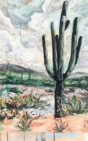 Desert landscape with a cactus and mountains in the background